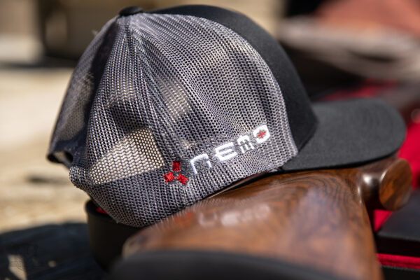 NEmo Trucker Hat on railing